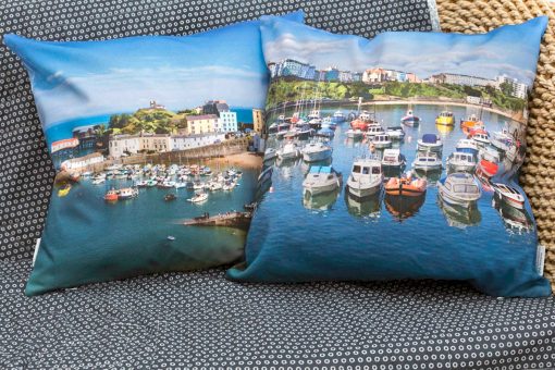 high quality panama cotton cushion with feather inner with high tide sunny image of tenby harbour on one side and then looking out at high tide from the harbour wall across bay with all the moored boats in the foreground of tenby harbour